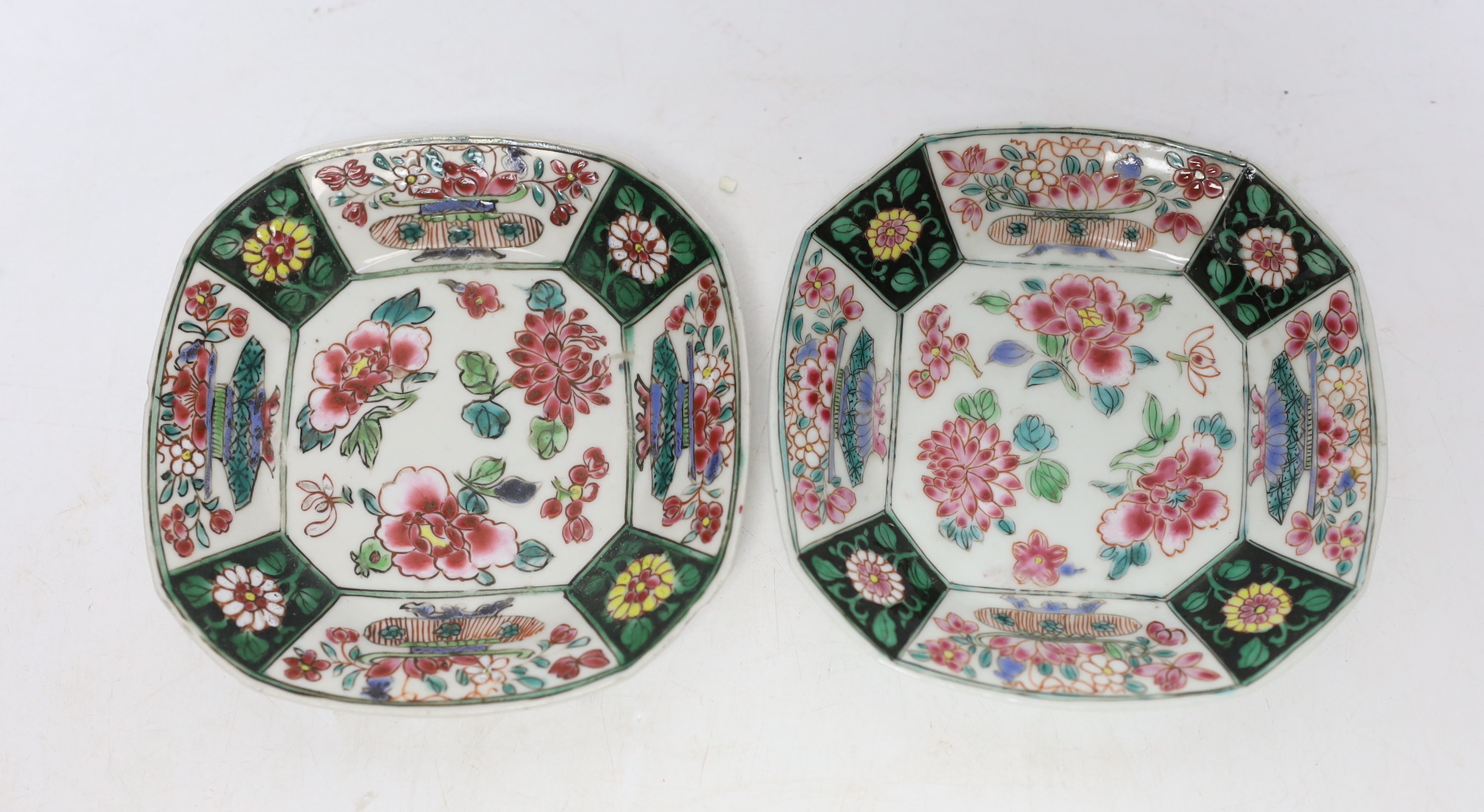 A pair of Chinese Qianlong famille rose octagonal cups and saucers, with panelled floral decoration, saucers 12cm cups height 6.5cm diameter 6.75cm